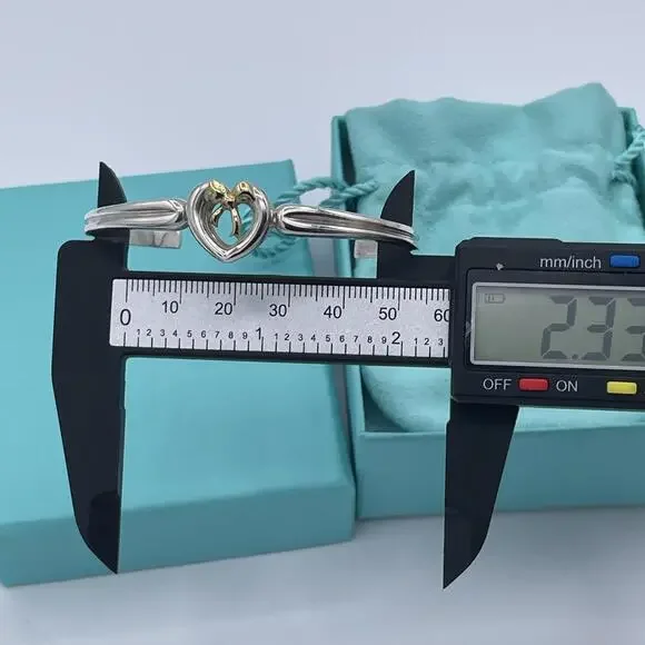 Tiffany & Co Sterling Silver and 18K Yellow Gold Heart Bow Ribbon Cuff Bracelet